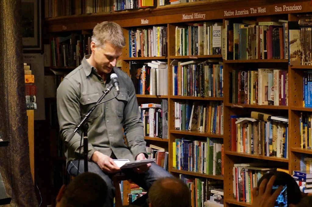 SF poet Jim Nawrocki reads from the work of his friend Hal Norse at Bird & Beckett Books 12/3/14. Photo by Tate Swindell.